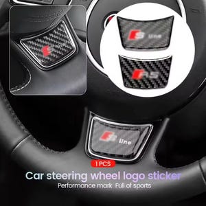 May include: Black carbon fibre car steering wheel logo stickers with red detailing. The image displays the S line and RS logos. The text at the bottom reads "Car steering wheel logo sticker" and "Performance mark Full of sports."