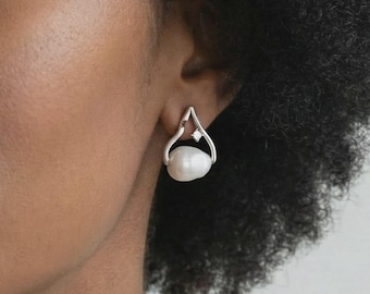 Sculpturale zoetwaterpareldruppeloorbellen, pennen van rhodium sterlingzilver