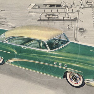 May include: A green and cream 1950s Buick Roadmaster sedan with chrome accents. The car is parked on a paved road with a dock and a boat in the background.