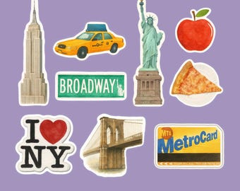 May include: A collection of New York City-themed stickers on a purple background. The stickers include the Empire State Building, a yellow taxi, the Statue of Liberty, a red apple, a slice of pizza, a Broadway sign, the Brooklyn Bridge, and an "I Love NY" logo.