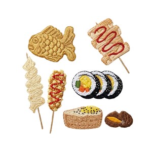 May include: A collection of embroidered patches featuring Japanese food items including a golden fish-shaped cake, a skewer with red sauce, a spiral skewer, a textured skewer with red sauce, three sushi rolls, a rectangular rice block, and a brown snack.