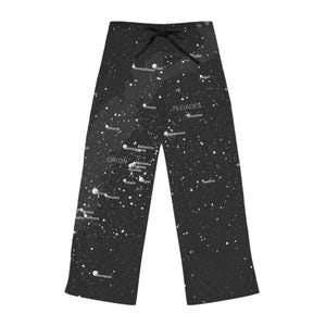May include: Black pajama pants with a white constellation design. The pants feature a drawstring waist and a print of stars and constellations, including Orion and the Pleiades. The fabric appears soft and comfortable.