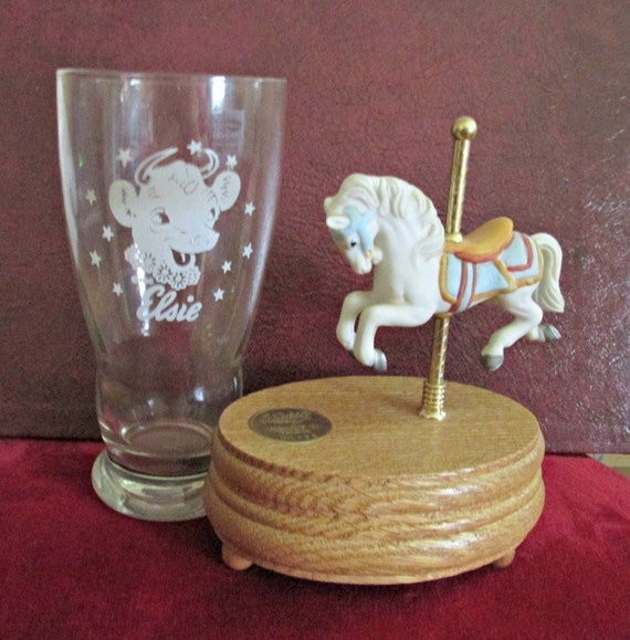 porcelain doll on carousel horse