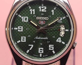 Reloj automático Seiko 5 para hombre, esfera verde vintage, mecánico japonés, con fecha y día.