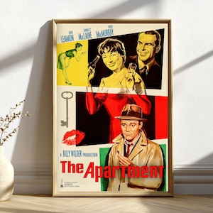 May include: A framed movie poster for "The Apartment" with a gold frame. The poster features images of the actors Jack Lemmon, Shirley MacLaine, and Fred MacMurray. The title "The Apartment" is in red letters.