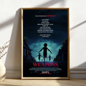 May include: Framed movie poster for "Weapons", featuring a dark, atmospheric design. The poster shows silhouettes of children running towards houses under a twilight sky. Text includes the film title, release date, and director's name.