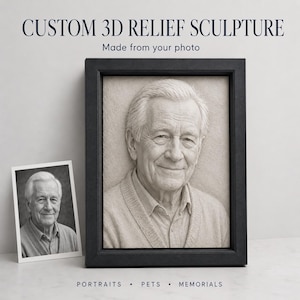 May include: A framed 3D relief sculpture of an older man, displayed next to a smaller photo of the same image. The sculpture is in a black frame, with the text "CUSTOM 3D RELIEF SCULPTURE" at the top. The bottom of the image reads "PORTRAITS • PETS • MEMORIALS."