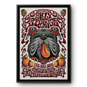 Op de afbeelding: Een ingelijste poster met een bulldog-illustratie, met een lange oranje tong, bloemen en een derde oog. De poster leest "Billy Strings", de datum "Feb 6&7 2026" en "Athens, Georgia" in rode, decoratieve letters.