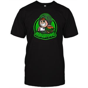 May include: A black t-shirt featuring a graphic of a cartoon character in a green hoodie holding a smartphone and a burger. The design is set within a circular green frame with the text #BURGERPOMMES printed in bold green letters at the bottom.