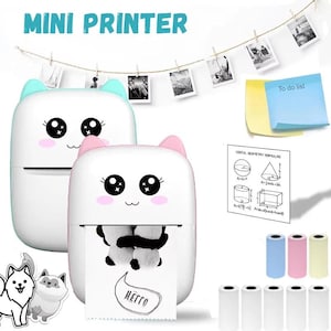 May include: Two white and pink cat-shaped mini printers with large eyes and a smiling mouth. The text "MINI PRINTER" is above the printers. The printer on the right is printing a panda image. Rolls of paper and colorful rolls are also visible.