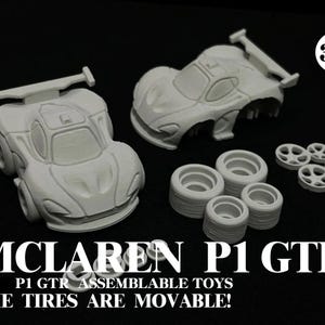 May include: A light gray McLaren P1 GTR assembleable toy set. The set includes two car bodies, wheels, and tires. The text on the image reads "THE TIRES ARE MOVABLE!"