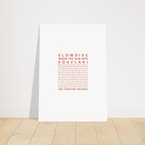May include: A white poster with red text. The poster features the band name "Slowdive" and album title "Souvlaki". Lyrics from the album are printed below the title. The text "1993 Creation Records" is at the bottom.