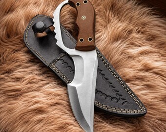 Cuchillo de hoja fija HavnBlades hecho a mano con mango con anillo para el dedo y funda de cuero.