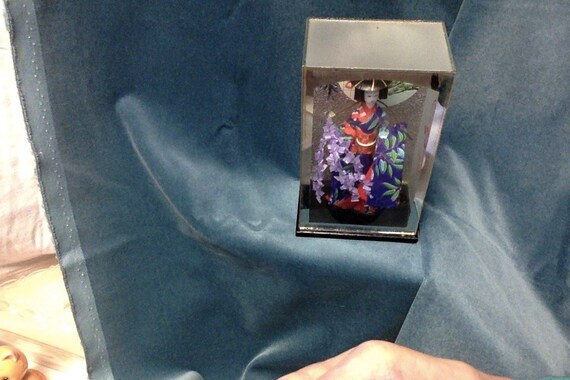 oriental dolls in glass cases