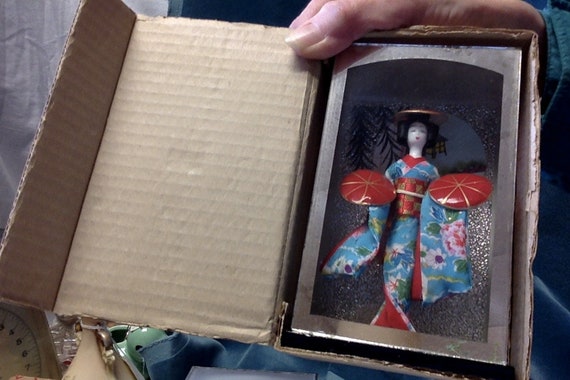 oriental dolls in glass cases