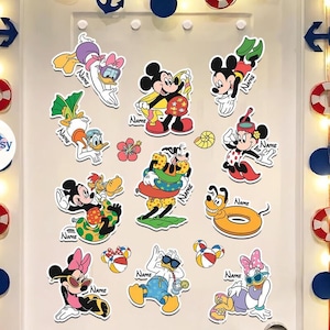 May include: A collection of colorful cartoon character stickers featuring Mickey Mouse, Minnie Mouse, Donald Duck, Daisy Duck, and Pluto in various beach and summer-themed poses. Each sticker has the word "Name" on it.