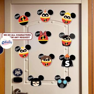May include: A collection of colorful character-themed decals, each featuring a Mickey Mouse-style head with various superhero designs. The decals are affixed to a white door. Text on the door reads "WE DO ALL CHARACTERS FROM ANY REQUEST."