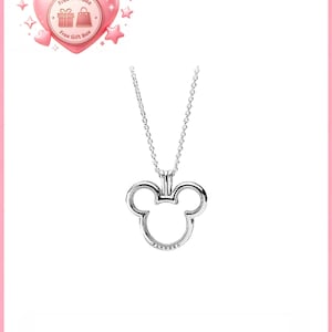 May include: A silver-colored necklace featuring a Mickey Mouse head pendant. The pendant has a hollow design with the brand name "Pandora" inscribed at the bottom. The necklace is displayed on a white background.