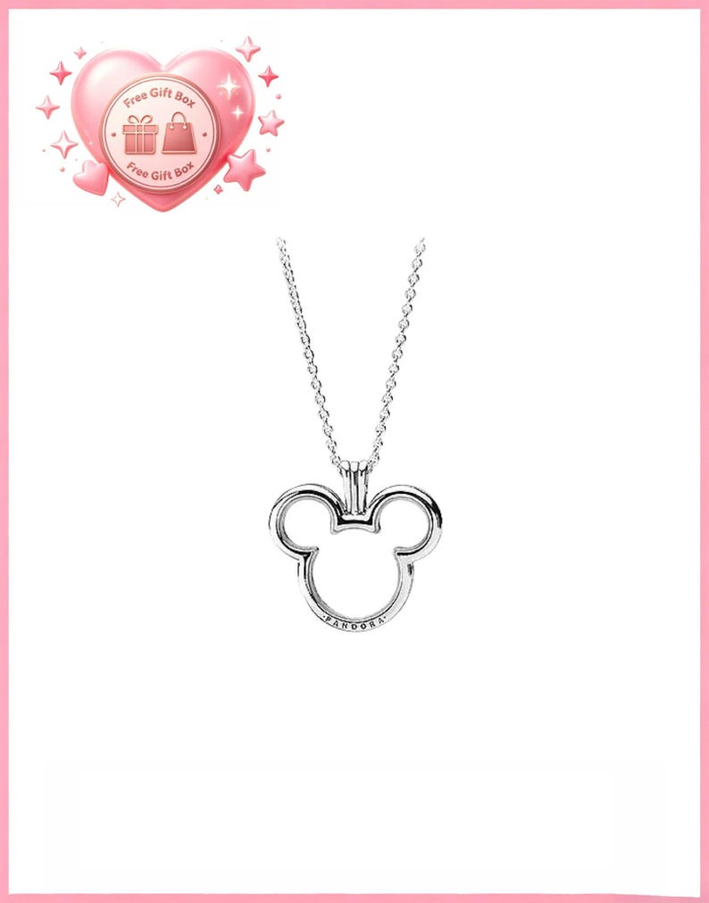 May include: A silver-colored necklace featuring a Mickey Mouse head pendant. The pendant has a hollow design with the brand name "Pandora" inscribed at the bottom. The necklace is displayed on a white background.