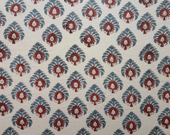 May include: Cream-colored fabric with a repeating pattern of stylized leaf shapes. Each leaf is composed of a dark teal outline with a burgundy center, creating a symmetrical design. The fabric has a textured appearance.