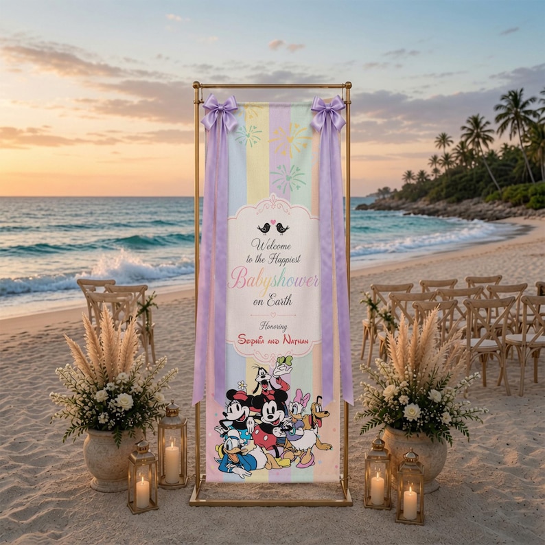 May include: A vertical rectangular banner held by a gold metal frame, featuring pastel vertical stripes, light blue firework graphics, and a central white label with the text Welcome to the Happiest Babyshower on Earth Honoring Sophia and Nathan.