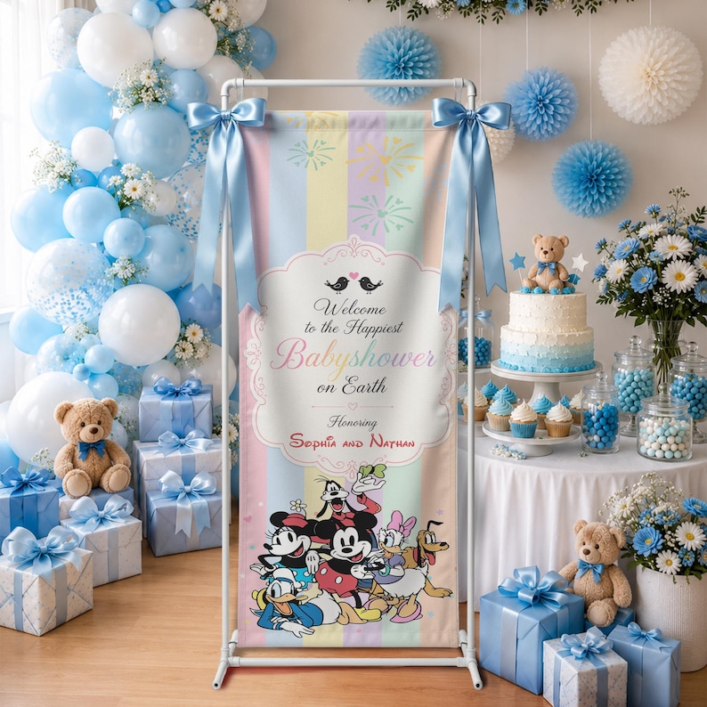 May include: A vertical banner on a white frame featuring pastel stripes, fireworks, and Disney characters. The text reads Welcome to the Happiest Babyshower on Earth Honoring Sophia and Nathan. It is surrounded by blue balloons, gifts, and a cake.