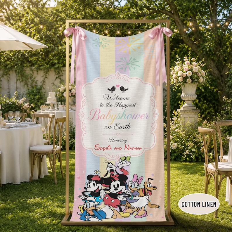 May include: A vertical rectangular banner made of cotton linen featuring pastel vertical stripes, pink ribbons at the top, and a central white frame with the text Welcome to the Happiest Babyshower on Earth Honoring Sophia and Nathan.
