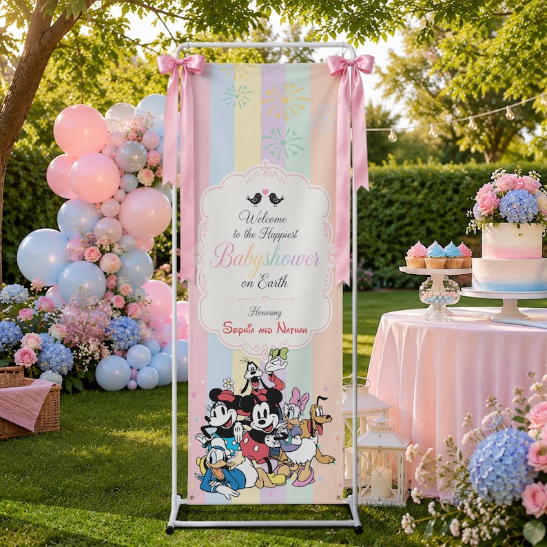May include: A vertical banner on a white metal stand featuring pastel vertical stripes, pink bows, and a central white frame with the text 'Welcome to the Happiest Babyshower on Earth Honoring Sophia and Nathan' above cartoon characters.