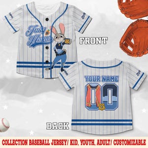 May include: A white baseball jersey with blue pinstripes, featuring a graphic of Judy Hopps on the front with the text Judy Hopps. The back displays the text YOUR NAME above the number 00, which includes a police badge graphic.