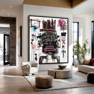 May include: Large abstract painting with a black, white, red, and yellow color scheme. The artwork features a stylized face with a crown, set against a white background. The painting is framed in black and hangs in a modern living room.