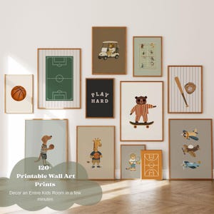 May include: A collection of twelve framed wall art prints featuring sports themes, including a basketball, a soccer field, a lion in a golf cart, tennis players, a bear on a skateboard, a baseball bat, a dog with a ball, a giraffe, and airplanes.