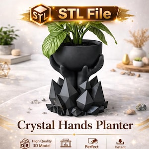 May include: Black crystal hands planter holding a potted plant with large green leaves. The planter has a unique design, with hands supporting the pot and a crystal-like base. The text "Crystal Hands Planter" is displayed below the planter.