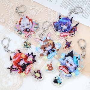 May include: Collection of acrylic keychains featuring anime-style characters. Each keychain has a unique design with vibrant colors and the text "ARKNIGHTS". The keychains are attached to silver-colored metal rings.