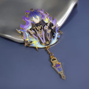May include: A detailed enamel pin featuring a character with blue hair and a black outfit, surrounded by purple flames and yellow stars. A gold chain connects to a gold and blue potion bottle charm. The pin is set against a blue background.