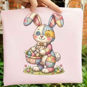 May include: A pink pillow featuring a patchwork bunny holding a basket of Easter eggs. The bunny has button eyes and a bow tie. The bunny's ears and body are made of colorful floral and gingham fabric. Easter-themed decorative pillow.