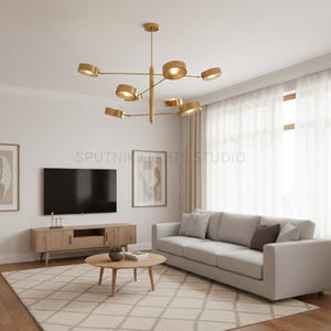May include: A modern living room featuring a gold-toned Sputnik chandelier. The room includes a light gray sofa, wooden media console, and a round coffee table. The text "SPUTNIK LIGHTS STUDIO" is visible on the wall.