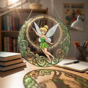 May include: A white ceramic mug with a black handle and the text "But First, Coffee" in a bold, black font. The mug is set against a blurred background, suggesting a cozy setting.