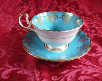 Aynsley Cup and Saucer. Teal with Gold overlay on both pieces