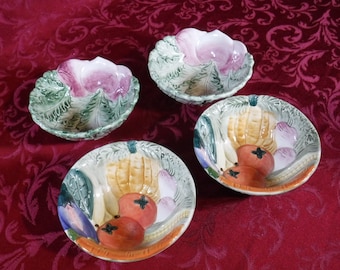 May include: Set of four small ceramic bowls with vegetable designs. The bowls feature a variety of vegetables, including tomatoes, carrots, corn, and eggplant. The bowls are green, yellow, orange, and purple.