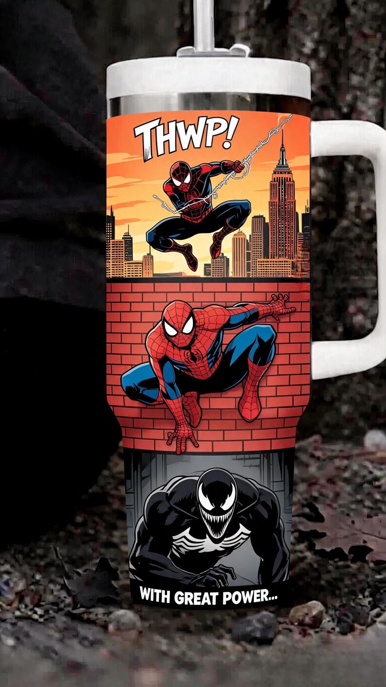 May include: A stainless steel tumbler with a white lid and handle featuring a graphic print of Spider-Man swinging over a city skyline with the text THWP!, Spider-Man crouching on a brick wall, and Venom with the text WITH GREAT POWER...