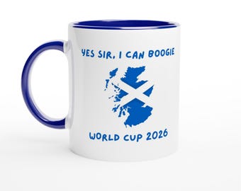 May include: White ceramic mug with a blue interior and handle. The mug features the text "YES SIR, I CAN BOOGIE" and "WORLD CUP 2026" in blue, along with a blue graphic of the Scottish flag.