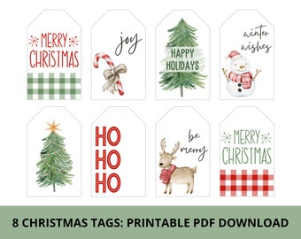 May include: Eight printable Christmas gift tags featuring various holiday themes. The tags include a green and white plaid design, a candy cane, a Christmas tree, a snowman, a reindeer, and the words "joy", "happy holidays", "ho ho ho", "be merry", "winter wishes", and "merry Christmas".