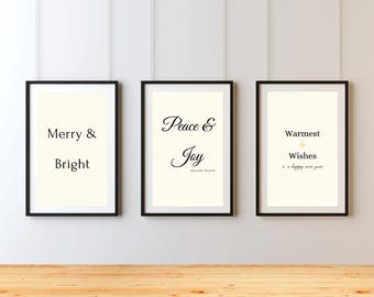 May include: Three framed art prints with black frames and off-white backgrounds. The prints display the phrases "Merry & Bright", "Peace & Joy", and "Warmest Wishes" in elegant black script, perfect for holiday decor.