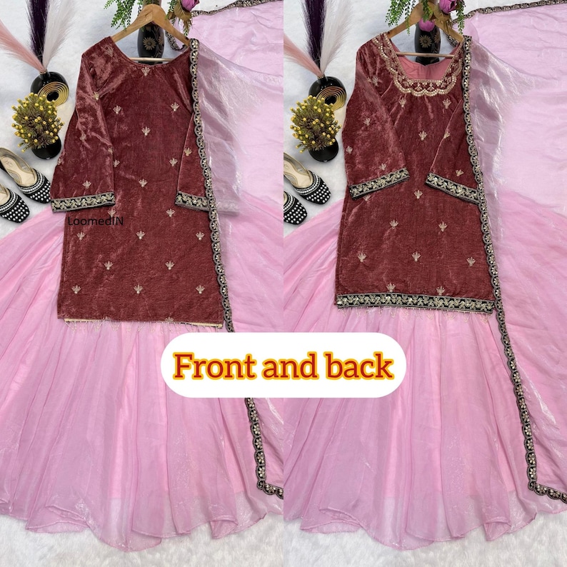 May include: A two-piece maroon velvet outfit with gold embroidery and a light pink skirt. The top has long sleeves and a round neckline. The skirt is a flowing, layered design. The text "Front and back" is visible.