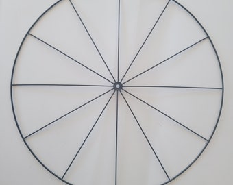 May include: A black metal hoop with 16 spokes, perfect for crafting or decorating.