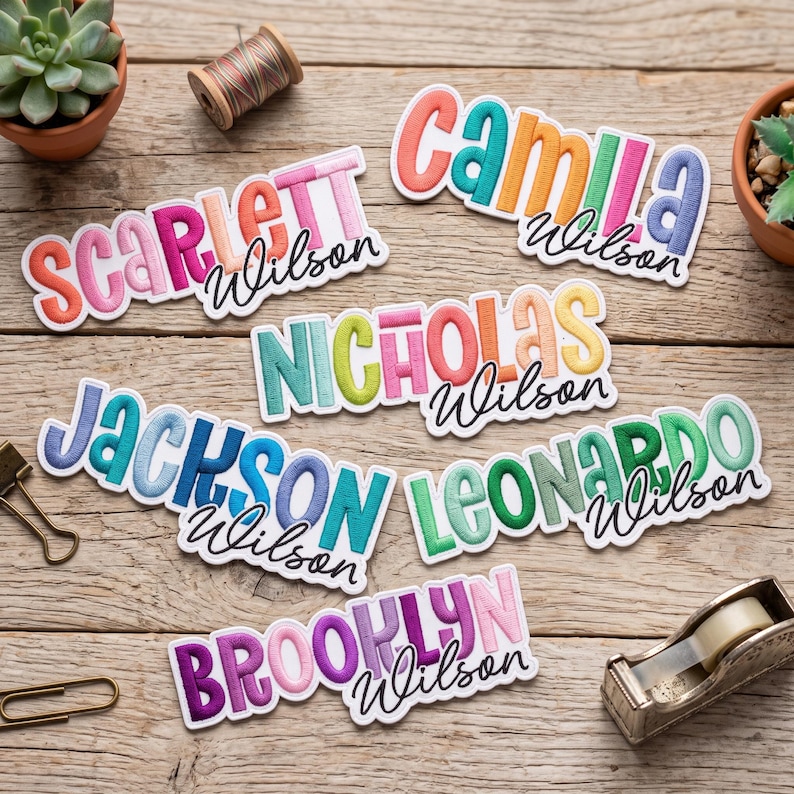May include: Six embroidered name patches featuring the names Scarlett, Camila, Nicholas, Jackson, Leonardo, and Brooklyn, each paired with the cursive surname Wilson. The letters are multi-coloured with a white border and a stitched texture.