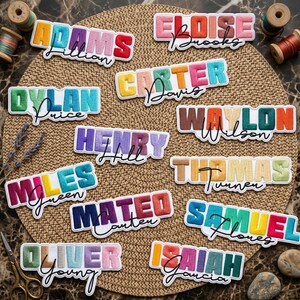 May include: Embroidered name patches in various colors, including Adams, Eloise, Dylan, Carter, Waylon, Henry, Miles, Thomas, Mateo, Samuel, Oliver, and Isaiah. Each patch features a name in a colorful, textured font with a cursive last name.