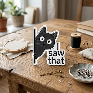 May include: A set of three ceramic mugs with a speckled, matte finish. The mugs are in shades of cream, light gray, and dark gray. Each mug has a simple, minimalist design and a rounded handle.