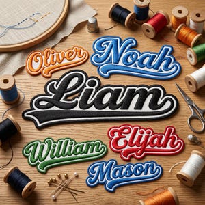 May include: Embroidered name patches in various colors, including orange, blue, black, green, and red. The names are "Oliver", "Noah", "Liam", "William", "Elijah", and "Mason". Sewing supplies, such as thread spools, scissors, and pins, are scattered around the patches.