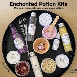 May include: A black tray holds an assortment of potion-making supplies. Bottles and jars contain ingredients like 'Pixie Petals' and 'Moonlight Crystals'. The text 'Enchanted Potion Kits' and 'Mix, pour, and create your own magical potions' are visible.